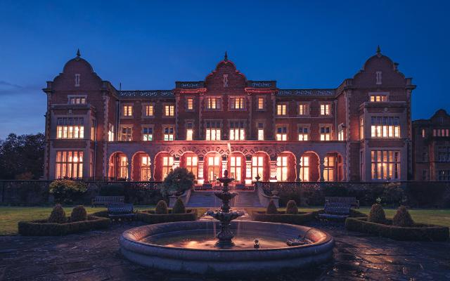 Wedding Venue Easthampstead Park in Wokingham taken early evening with the venue illuminated