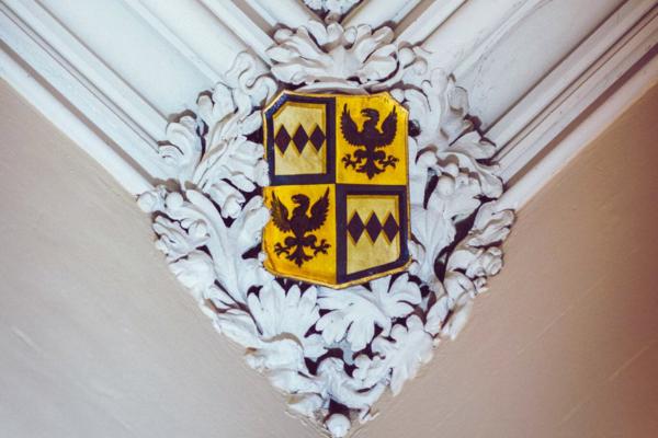 Ditton Manor interior featuring the Montagu Family crest in yellow and black