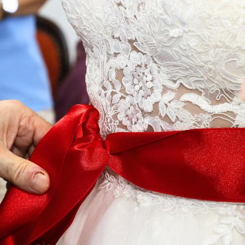 red ribbon around bride turkish wedding tradition