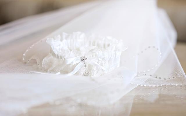 Wedding garter on brides veil