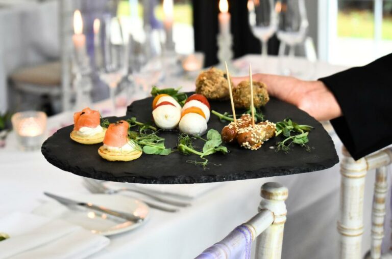 Delicious wedding canapes on a heart platter