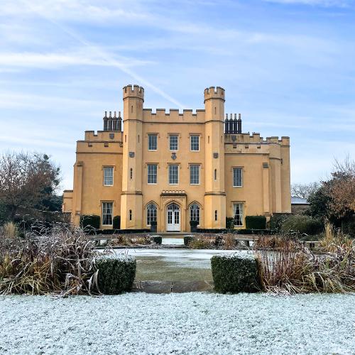 Exterior of snowy Ditton Manor, perfect for Christmas events in Slough