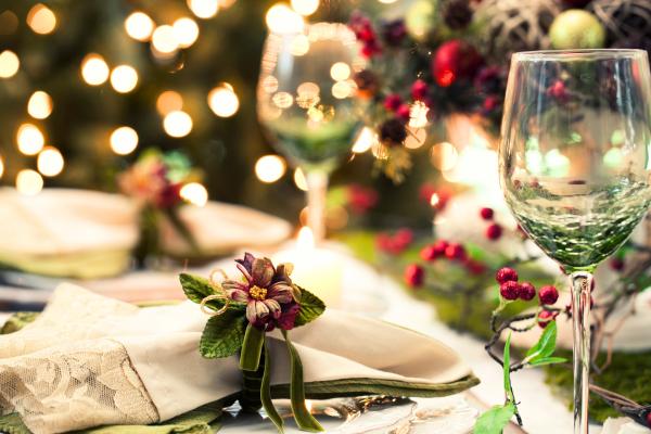 Festive table decor featuring our article on "How To Plan A Christmas Party"