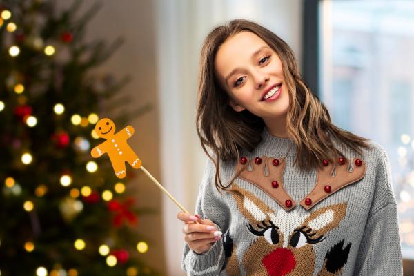 Women wearing Christmas jumper to work do, one of the best Work Christmas Party Ideas