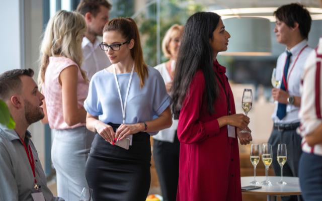 Professional Networking featuring a group chatting at an event